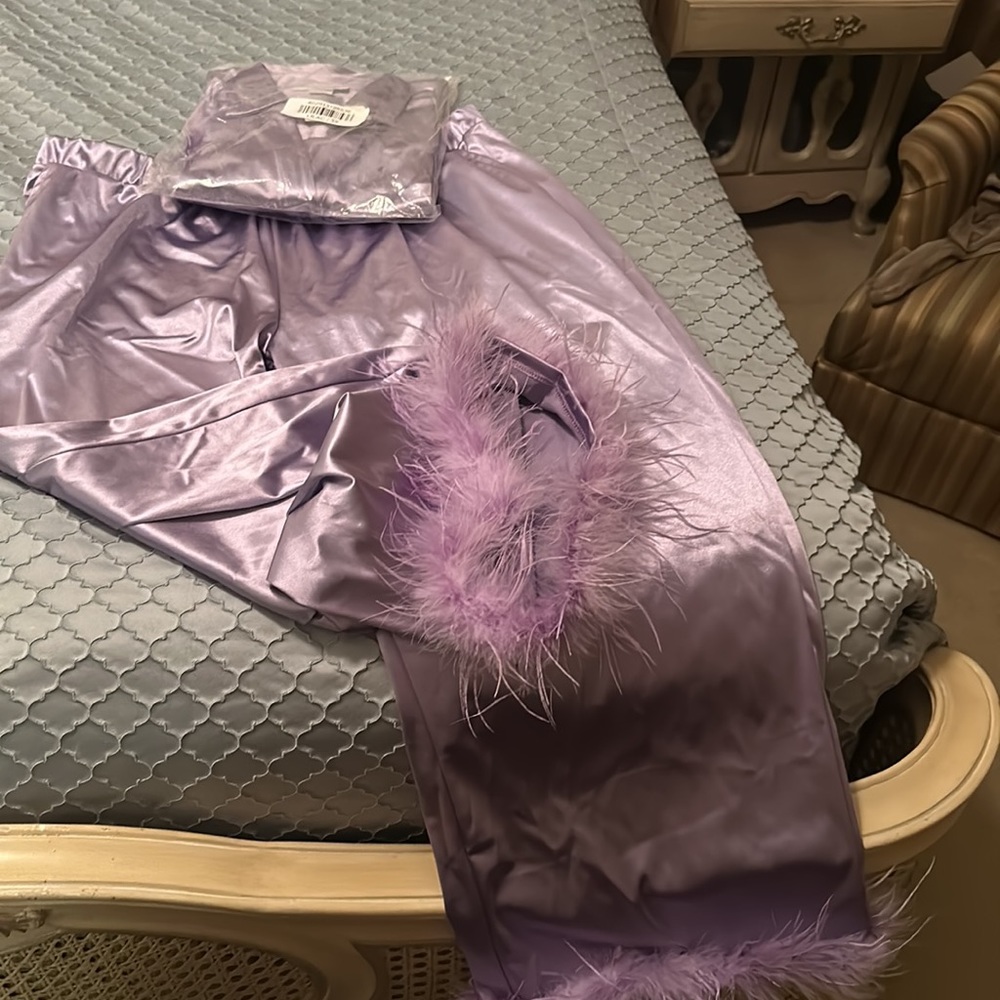 Ashley Stewart’s curvy girl, line lilac satin pajamas with ostrich feather hem